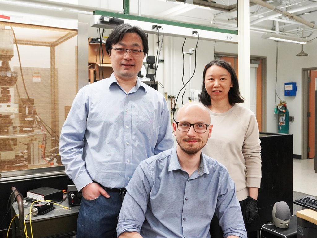 Associate Professor Bozhi Tian with graduate students Aleksander Prominski and Lingyuan Meng.